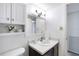 Updated bathroom featuring a vanity, mirror, and storage cabinet at 4151 S Atlantic Ave # 5110, New Smyrna Beach, FL 32169