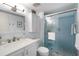Bathroom featuring a tiled shower, sleek vanity, and modern fixtures at 4151 S Atlantic Ave # 5110, New Smyrna Beach, FL 32169