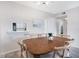 Bright dining room featuring a wood table and seating for six at 4151 S Atlantic Ave # 5110, New Smyrna Beach, FL 32169
