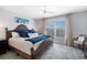 Bedroom with a ceiling fan, stylish decor and a large window at 4151 S Atlantic Ave # 5110, New Smyrna Beach, FL 32169