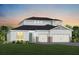 Charming two-story home with a manicured lawn, two-car garage, and beautiful architectural details at 5206 Handsome Hills Dr, Mount Dora, FL 32757