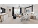 Inviting living room featuring a plush sofa, modern decor, dark black accent wall, and abundant natural light at 5206 Handsome Hills Dr, Mount Dora, FL 32757