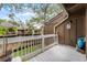Exterior porch with white railings overlooking green space at 5310 Pebble Beach Dr # F, Orlando, FL 32811
