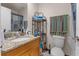 Well-lit bathroom featuring granite countertops and storage shelves at 5310 Pebble Beach Dr # F, Orlando, FL 32811