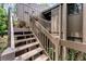 Charming home exterior featuring a private entry with stairs and a wood facade at 5310 Pebble Beach Dr # F, Orlando, FL 32811