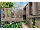 Inviting home exterior featuring a private entry deck with potted plants and lush landscaping at 5310 Pebble Beach Dr # F, Orlando, FL 32811