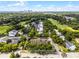 Aerial view of the property showcasing landscaping, golf course and nearby city skyline at 538 W Par St # 538, Orlando, FL 32804