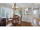Charming dining room showcasing hardwood floors and plantation shutters, complemented by a decorative chandelier at 538 W Par St # 538, Orlando, FL 32804