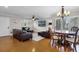 Inviting living room with hardwood floors, plantation shutters, a ceiling fan, and a dining area, perfect for entertaining at 538 W Par St # 538, Orlando, FL 32804