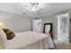 The main bedroom has an ensuite bathroom, ceiling fan and neutral colored walls and carpeting at 538 W Par St # 538, Orlando, FL 32804