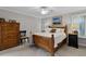 This is a spacious bedroom with a traditional wooden bed frame and a matching dresser at 538 W Par St # 538, Orlando, FL 32804