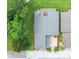 Aerial shot of the home, highlighting the roof, patio, landscaping, and surrounding greenery at 545 Mystic Wood St, Casselberry, FL 32707
