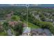 An aerial view outlines the property and its position in a neighborhood with mature trees at 545 Mystic Wood St, Casselberry, FL 32707
