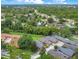 Aerial view showcasing a neighborhood with lush landscaping and mature trees at 545 Mystic Wood St, Casselberry, FL 32707