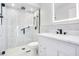 Modern bathroom showcasing a glass-enclosed shower with white tiles, a vanity, and a toilet at 545 Mystic Wood St, Casselberry, FL 32707