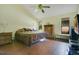Bedroom with wood floors, neutral walls, ceiling fan, and a window providing natural light at 545 Mystic Wood St, Casselberry, FL 32707