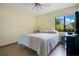 Bedroom featuring neutral walls, wood floors, a ceiling fan, and natural lighting from a window at 545 Mystic Wood St, Casselberry, FL 32707