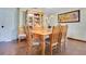 Bright dining room featuring a wooden table with seating for eight and hardwood floors at 545 Mystic Wood St, Casselberry, FL 32707