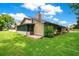 Charming home featuring a screened in patio and well-maintained lawn at 545 Mystic Wood St, Casselberry, FL 32707