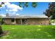 Charming single-story home with a large front lawn, mature trees, and well-maintained landscaping at 545 Mystic Wood St, Casselberry, FL 32707