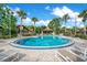 Community pool featuring a pool deck, lounge chairs, and tropical landscaping at 545 Mystic Wood St, Casselberry, FL 32707