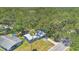 Aerial view of the home surrounded by lush trees and greenery at 606 Washington St, Daytona Beach, FL 32114