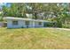 Inviting single-story home with a fresh exterior and a sprawling green lawn at 606 Washington St, Daytona Beach, FL 32114
