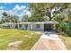 Attractive home featuring a newly paved driveway leading up to the covered carport at 606 Washington St, Daytona Beach, FL 32114