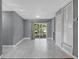 Open living space with sliding glass doors to yard and tile flooring at 606 Washington St, Daytona Beach, FL 32114