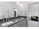 Modern bathroom with double vanity, contemporary fixtures, and bright lighting at 617 Worthington Dr, Winter Park, FL 32789