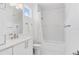 Clean and bright bathroom with a shower/tub combo, white cabinets and modern fixtures at 617 Worthington Dr, Winter Park, FL 32789