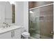Stylish bathroom with glass-enclosed shower, tiled walls, and modern fixtures at 617 Worthington Dr, Winter Park, FL 32789