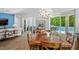 Well-lit dining room with backyard view, connecting to the living space with patio access at 617 Worthington Dr, Winter Park, FL 32789
