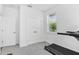 Well-lit exercise room with a treadmill and a view of the outdoors at 617 Worthington Dr, Winter Park, FL 32789