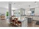 Open concept kitchen features a large island with modern appliances adjacent to the living and dining areas at 617 Worthington Dr, Winter Park, FL 32789