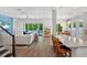 Open-concept living area with hardwood floors, modern furnishings, and views of the backyard pool at 617 Worthington Dr, Winter Park, FL 32789