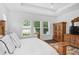 The main bedroom features natural light from the windows, and an adjacent wardrobe and dresser at 617 Worthington Dr, Winter Park, FL 32789