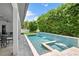 Backyard pool with spa and tranquil waterfall feature at 617 Worthington Dr, Winter Park, FL 32789