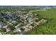 Aerial view of a residential area featuring well-maintained homes and natural wooded area with ponds at 705 Sunburst Cove Ln, Winter Garden, FL 34787