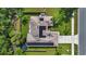 Bird's eye view of the home with solar panels, a fenced backyard, and a well-maintained lawn at 705 Sunburst Cove Ln, Winter Garden, FL 34787