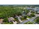 Aerial view of a residential neighborhood featuring lush greenery and well-maintained homes at 705 Sunburst Cove Ln, Winter Garden, FL 34787