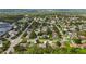 A residential neighborhood with well-maintained homes, mature trees, and landscaped yards at 705 Sunburst Cove Ln, Winter Garden, FL 34787