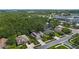 Aerial view of a residential neighborhood featuring lush greenery and well-maintained homes at 705 Sunburst Cove Ln, Winter Garden, FL 34787