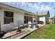 The backyard includes a screened in porch and a grilling area at 705 Sunburst Cove Ln, Winter Garden, FL 34787