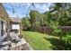 This backyard includes a trampoline and a fenced in yard at 705 Sunburst Cove Ln, Winter Garden, FL 34787