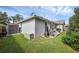 This backyard includes a small storage shed and a grilling area at 705 Sunburst Cove Ln, Winter Garden, FL 34787