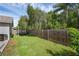 This backyard includes a trampoline and a fenced in yard at 705 Sunburst Cove Ln, Winter Garden, FL 34787