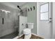 Bathroom featuring glass enclosed shower and a toilet at 705 Sunburst Cove Ln, Winter Garden, FL 34787