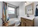 Renovated bathroom features a new vanity, mirror, and a shower with a rainfall showerhead at 705 Sunburst Cove Ln, Winter Garden, FL 34787
