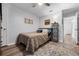 Cozy bedroom with a comfy bed, stylish rug, and ample natural light, creating a relaxing retreat at 705 Sunburst Cove Ln, Winter Garden, FL 34787